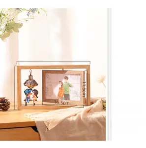 Close-up of 6-inch rotating wooden photo frame with light bulb and couple figures