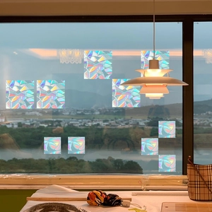 Rainbow prism static window film showing holographic colorful light reflection on glass