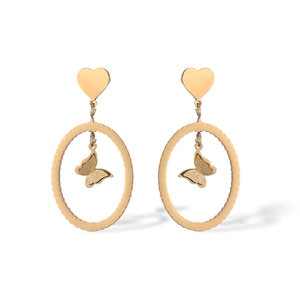 Detailed view of golden butterfly pendant with textured oval frame and heart stud