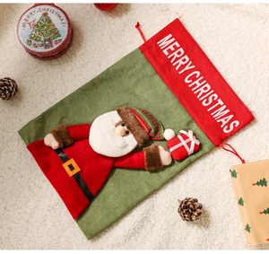 Christmas drawstring burlap gift bag with a 3D Santa Claus and Merry Christmas text