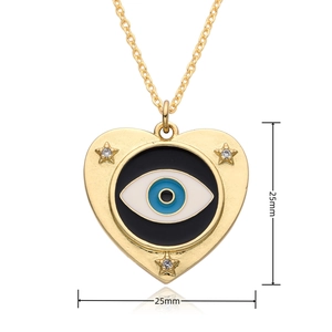 Detailed view of 25mm gold heart pendant with evil eye enamel and rhinestone stars
