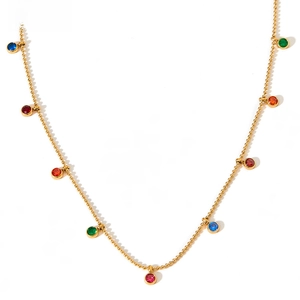 Detail of gold beaded necklace featuring colorful round cubic zirconia pendant charms