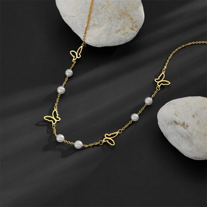 Pastoral hollow butterfly pearl pendant necklace in gold stainless steel on stone base