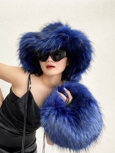 Faux fur winter set featuring a dark blue oversized plush hat and matching fluffy handbag
