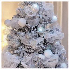 Detail of white and silver Christmas tree ornaments including mesh ribbons and glitter socks