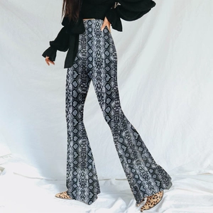 High waisted leopard print flared trousers in grey and white snake skin pattern