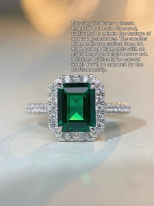 Macro detail of emerald cut green gemstone with 5A high carbon diamond accents