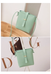 Detail view of mint green PU leather bucket bag with golden buckle and zipper closure
