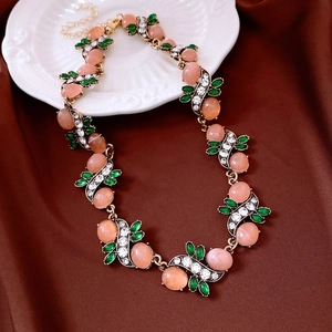 Vintage floral necklace with pink oval resin and rhinestones on decorative plate