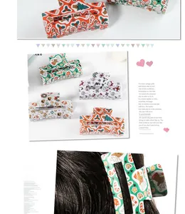 Detailed view of Christmas hair claws with Santa, reindeer, and candy cane patterns