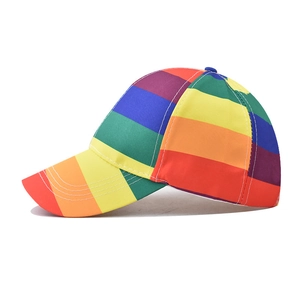 Side view of a bright rainbow striped cotton baseball cap with six vibrant colors
