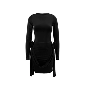 Detail of 3D flower embellishments and side ruffles on this black long sleeve mini dress