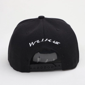 Black snapback baseball cap with paisley pattern and white WUKU embroidery detail