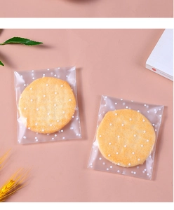 Detailed view of frosted self-adhesive snack bags with white polka dots for cookies