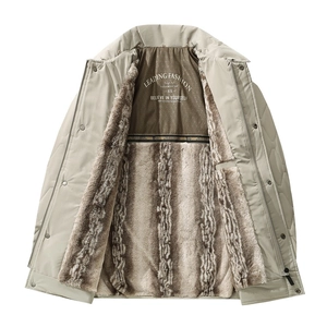 Detail view of winter parka showing thick faux fur lining and inner brand printing
