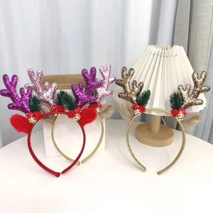 Detail of Christmas reindeer antler headbands with sequins, bells and festive decorations