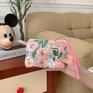 Pochette de maquillage florale avec poignée rose tressée et fermeture éclair en métal