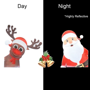 Day and night contrast showing highly reflective Christmas reindeer and Santa car magnets
