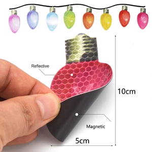 Detail of 10x5cm reflective magnetic Christmas bulb sticker showing its magnetic backing