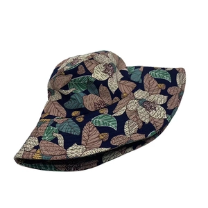 Detail of vintage floral print bucket hat in navy blue with high-quality stitching texture