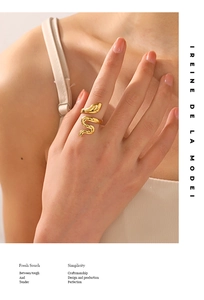 Close-up of 18K gold plated stainless steel snake ring worn on a finger