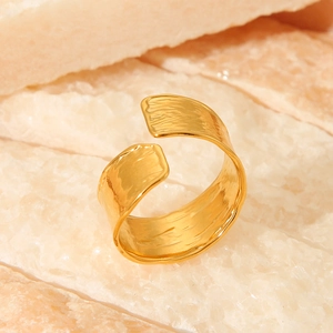 Detailed close-up of 18K gold plated stainless steel ring with a hammered textured finish