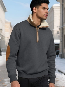 Detail of grey men's sweatshirt featuring khaki leather patches and fleece lining