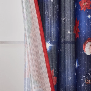 Close-up of Santa Claus and snowflake prints on navy blue Christmas curtain with red piping