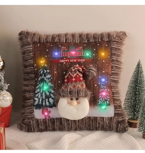 Detail of LED light-up Christmas pillow cover featuring Santa Claus and plush brown trim