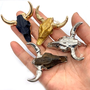 Bull skull pendant necklace charms in gold, silver, black, and natural stone styles