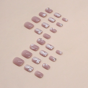 Short square press-on nails with butterfly floral art and rhinestones in dusty pink
