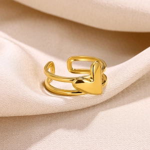 Detailed close-up of 18k gold-plated double-layer heart ring on champagne silk fabric