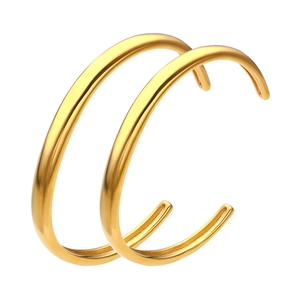 Minimalist gold-plated C-shaped earrings with a polished round surface on a white background