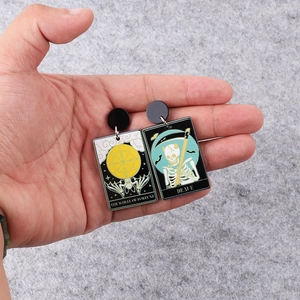 Punk tarot skull acrylic earrings featuring The Wheel of Fortune and Death patterns
