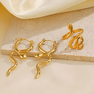 Golden stainless steel snake jewelry set with hoop earrings and wrap ring on stone