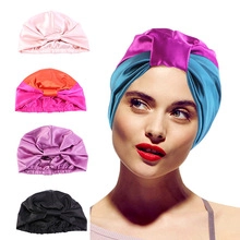Multiple colors of pleated satin turban hats for women including pink and purple