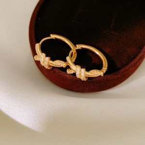 18k gold plated knotted hoop earrings with sparkling cubic zirconia pavé detailing