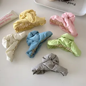 Set of six colorful pleated fabric hair claw clips in pastel macaron shades for women