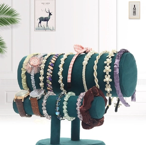 Close-up of double-layer dark green velvet cylinders for headbands and bracelets