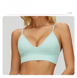 Close-up of mint green seamless yoga bra featuring V-neckline and ribbed knit texture