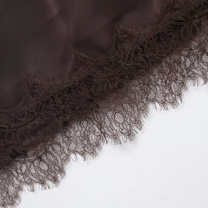 Lace detail on deep brown satin dress with eyelash lace trim and silk texture