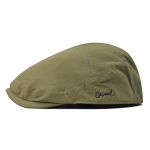 Detail of olive green newsboy cap featuring black Camel cursive embroidery on the side