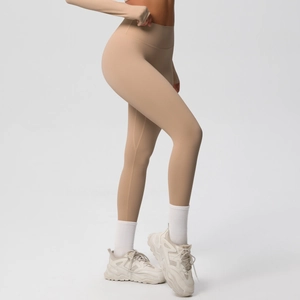 Side view of high-waist yoga leggings showing slim fit and shaping effect on model