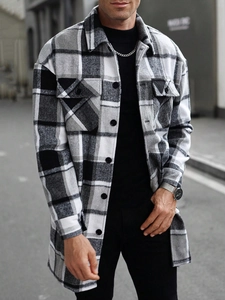 Detail of men's flannel plaid jacket featuring chest pockets and black button closure