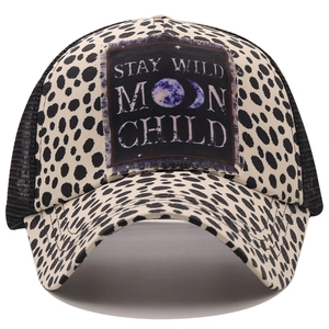 Close-up of leopard print baseball cap with Stay Wild Moon Child patch and mesh back