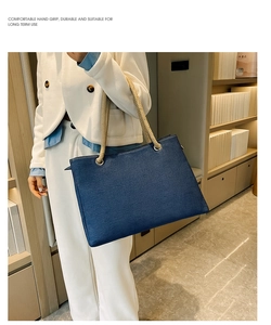 Detail showing deep blue denim tote bag with durable beige hemp rope handles