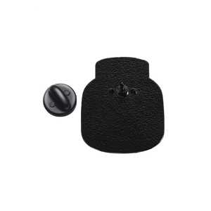 Detail of matte black metal pin back with secure rubber clutch on white background