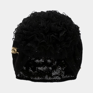 Elegant black lace turban hat for babies with large floral ruffle and gold bee charm