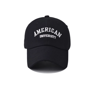 Close-up of white American University embroidery on black cotton baseball cap
