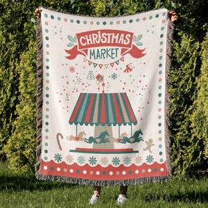 Detail of Christmas Market woven throw blanket with colorful fringe and festive patterns